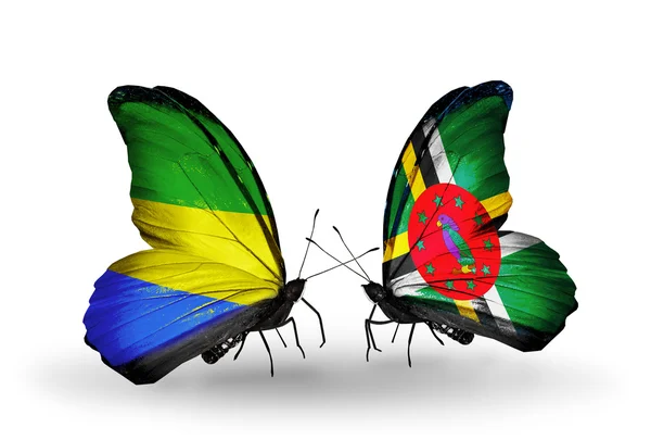 Butterflies with Gabon and Dominica flags on wings — Stock Photo, Image