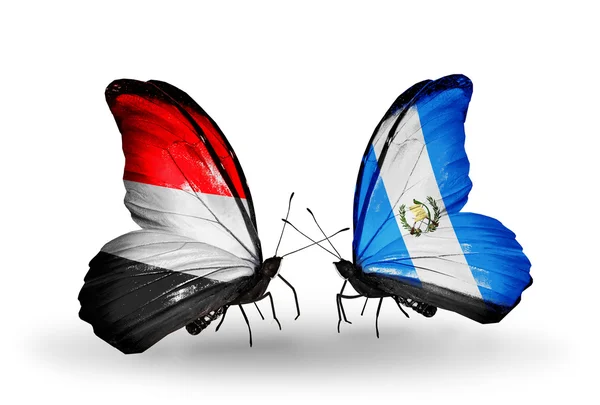 Borboletas com bandeiras do Iêmen e Guatemala em asas — Fotografia de Stock