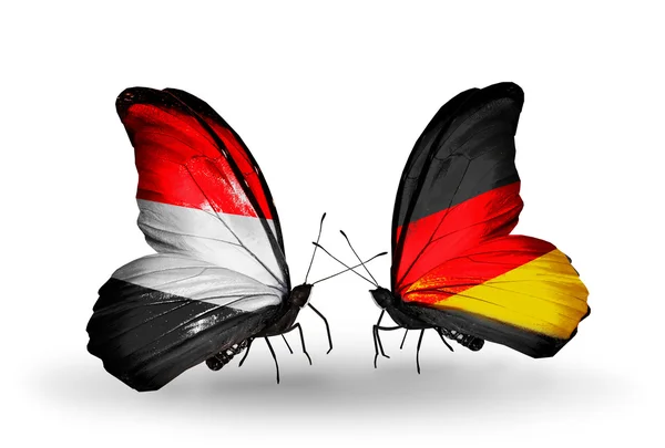 Butterflies with Yemen and  Germany flags on wings — Stock Photo, Image