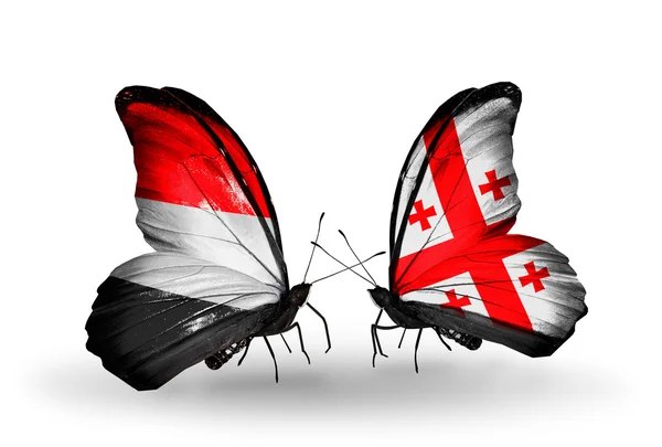 Mariposas con banderas de Yemen y Georgia en alas — Foto de Stock
