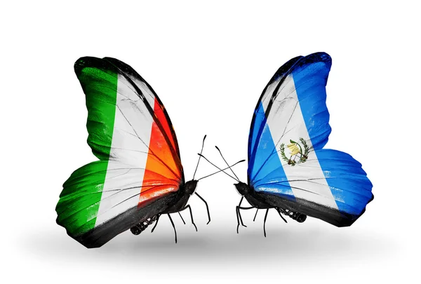 Butterflies with Ireland and Guatemala flags on wings — Stock Photo, Image