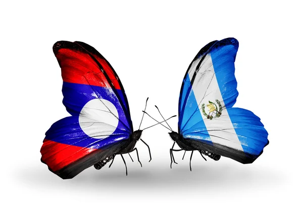 Papillons avec drapeaux du Laos et du Guatemala sur les ailes — Photo