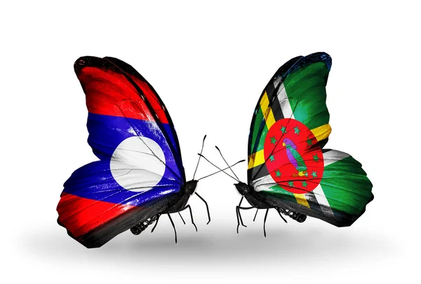 Mariposas con banderas de Laos y Dominica en alas — Foto de Stock