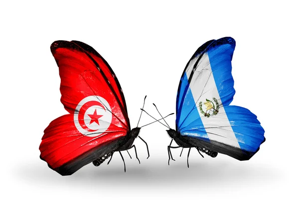 Papillons avec drapeaux Tunisie et Guatemala sur les ailes — Photo