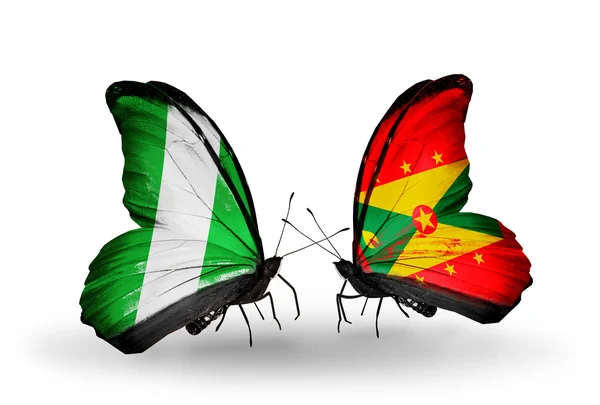 Butterflies with Nigeria and Grenada flags on wings — Zdjęcie stockowe