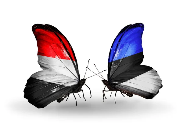 Papillons avec des drapeaux au Yémen et l'Estonie sur les ailes蝴蝶翅膀上的也门和爱沙尼亚国旗 — 图库照片