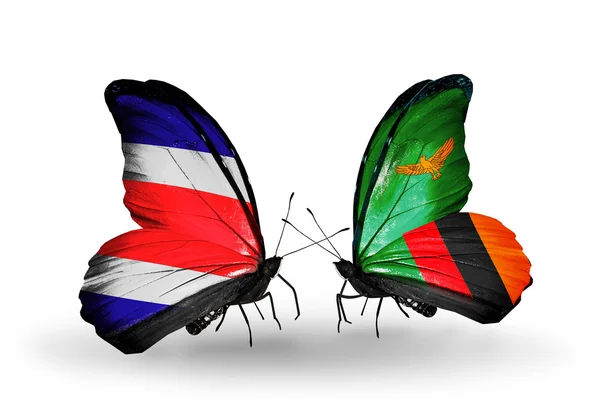Kosta Rika ve Zambiya bayrağı kanatlar üzerinde kelebekler — Stok fotoğraf