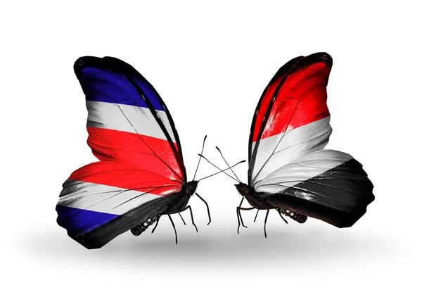 Borboletas com bandeiras da Costa Rica e do Iêmen em asas — Fotografia de Stock