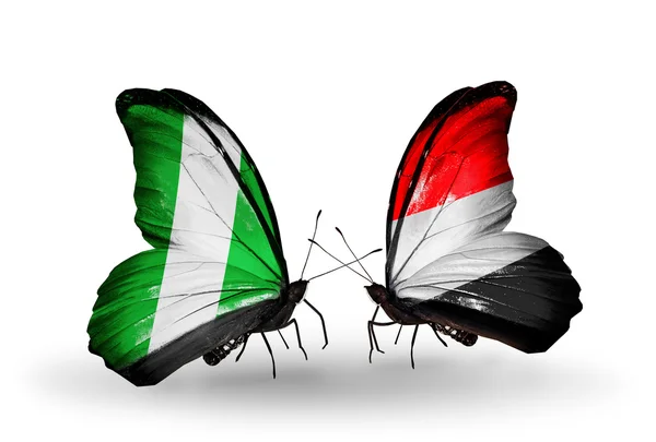 Butterflies with Nigeria and  Yemen flags on wings — Stock Photo, Image