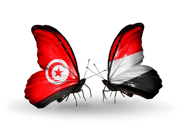 Butterflies with Tunisia and Yemen flags on wings — Stock Photo, Image