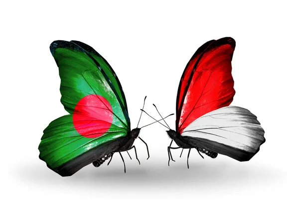 与孟加拉国和摩纳哥，印度尼西亚国旗上的翅膀的蝴蝶 — 图库照片