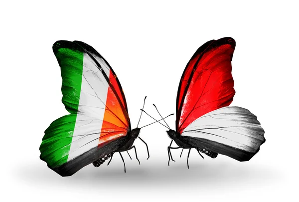Бабочки с Ирландией и Монако, флаги Индонезии на крыльях — стоковое фото