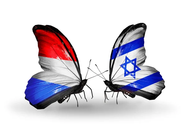 Butterflies with Luxembourg and Israel flags on wings — Stock Photo, Image