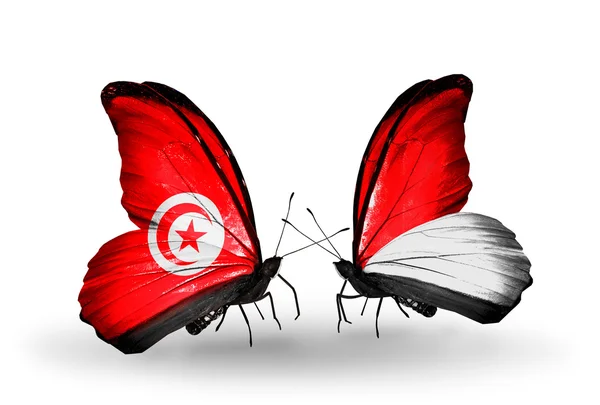 Papillons avec Tunisie et Monaco, Indonésie drapeaux sur les ailes — Photo