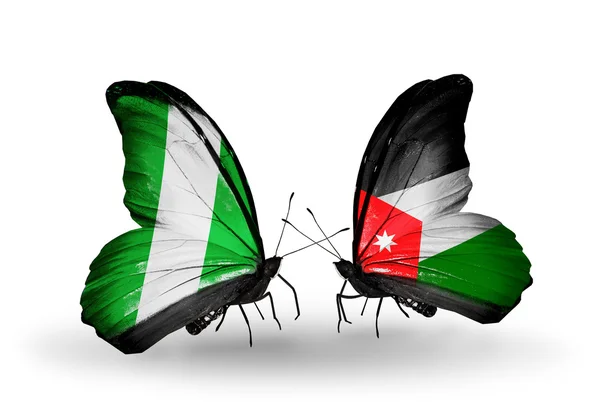 Butterflies with Nigeria and   Jordan flags on wings — Stock Photo, Image