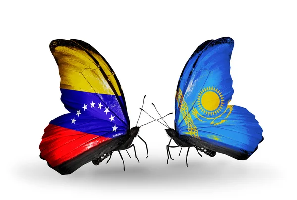 Papillons avec drapeaux du Venezuela et du Kazakhstan sur les ailes — Photo
