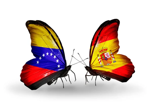 Papillons avec le Venezuela et l'Espagne drapeaux sur les ailes — Photo