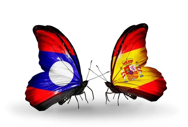 Borboletas com bandeiras Laos e Espanha em asas — Fotografia de Stock