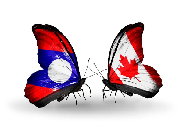 Papillons avec drapeaux du Laos et du Canada sur les ailes — Photo