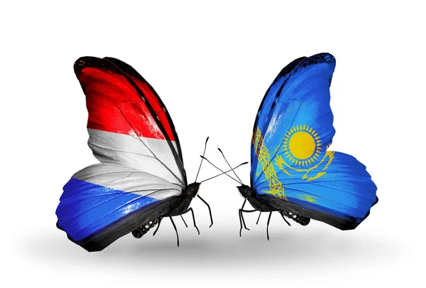 Butterflies with Luxembourg and Kazakhstan flags on wings — Stock Photo, Image