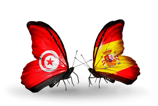 Farfalle con bandiere Tunisia e Spagna sulle ali — Foto Stock