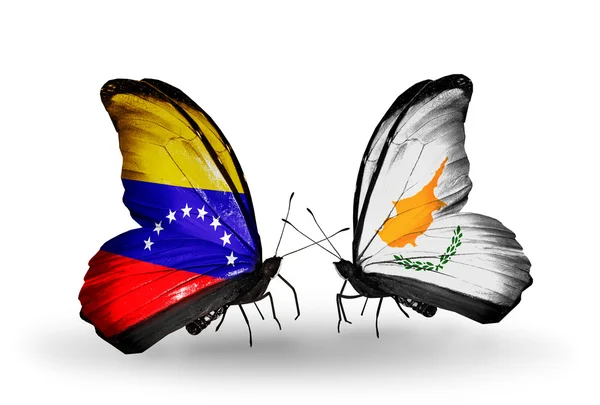 Butterflies with Venezuela and Cyprus flags on wings — Stock Photo, Image