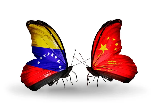 Motyle z Wenezueli i Chiny flagi na skrzydłach — Zdjęcie stockowe