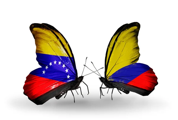 Farfalle con bandiere Venezuela e Colombia sulle ali — Foto Stock