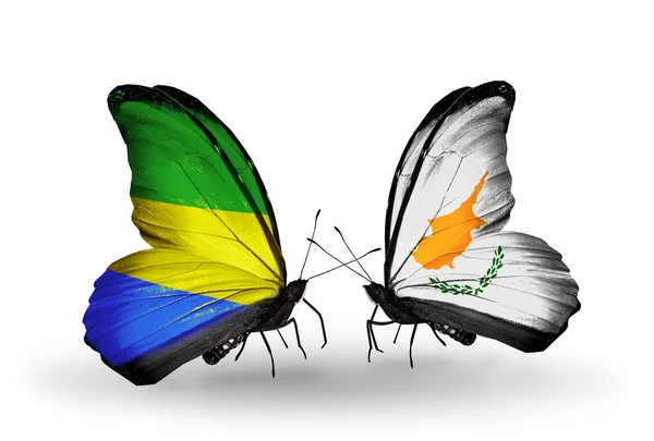 Butterflies with Gabon and Cyprus flags on wings — Stock Photo, Image