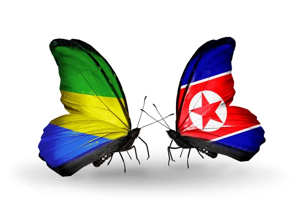 Butterflies with Gabon and North Korea flags on wings — Stock Photo, Image