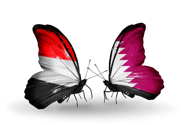 Kelebek kanatları üzerinde yemen ve Katar bayraklı — Stok fotoğraf