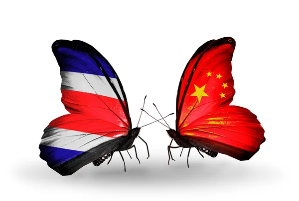Borboletas com bandeiras da Costa Rica e da China em asas — Fotografia de Stock
