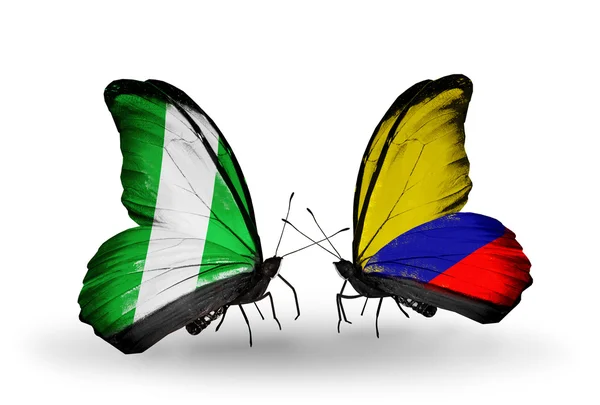 Papillons avec drapeaux Nigeria et Columbia sur les ailes — Photo