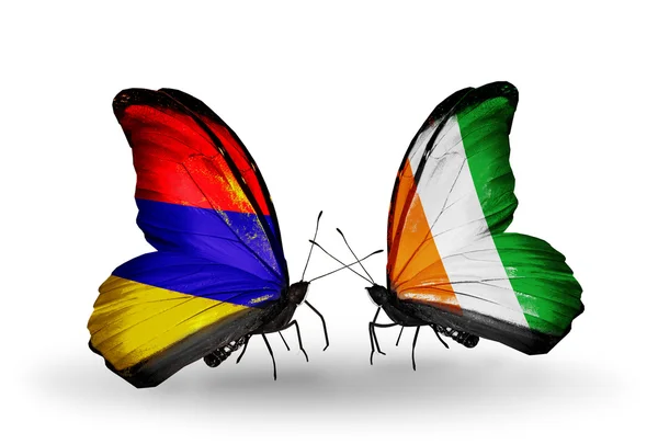 Kelebek kanatları üzerinde Ermenistan ve Fildişi Sahili bayraklı — Stok fotoğraf