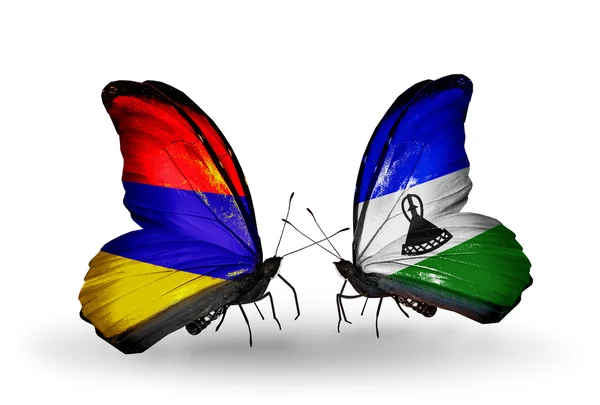 Mariposas con banderas de Armenia y Lesotho en alas — Foto de Stock