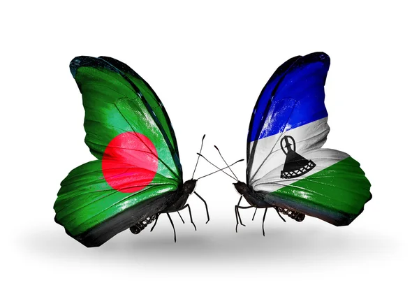 Papillons avec des drapeaux du Bangladesh et du Lesotho sur les ailes — Photo