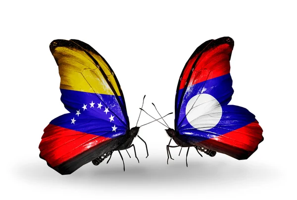 Fjärilar med venezuela och laos flaggor på vingar — Stockfoto