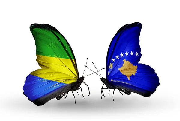 Motyle z Gabonu i Kosowie flagi na skrzydłach — Zdjęcie stockowe