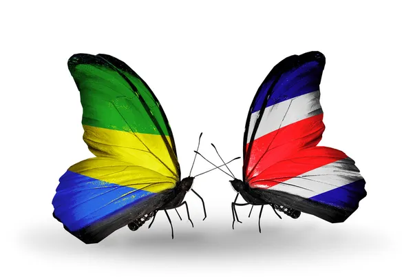 Papillons avec drapeaux du Gabon et du Costa Rica sur les ailes — Photo