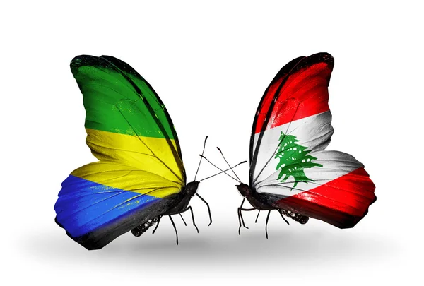 Papillons avec drapeaux Gabon et Liban sur les ailes — Photo