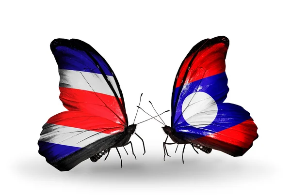 Papillons avec drapeaux du Costa Rica et du Laos sur les ailes — Photo