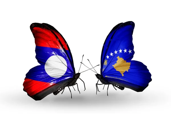 Motyle z Laosu i Kosowie flagi na skrzydłach — Zdjęcie stockowe