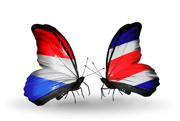 Borboletas com bandeiras de Luxemburgo e Costa Rica em asas — Fotografia de Stock