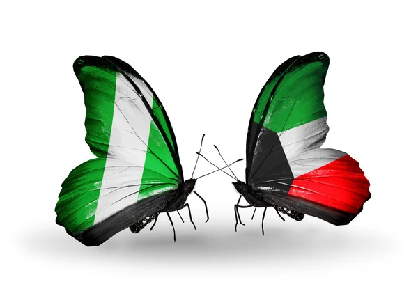 Mariposas con banderas de Nigeria y Kuwait en alas — Foto de Stock