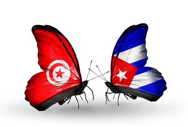 Kelebek kanatları üzerinde Tunus ve Küba bayraklı — Stok fotoğraf