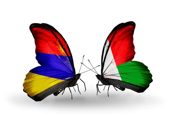 Borboletas com bandeiras da Armênia e Madagascar em asas — Fotografia de Stock