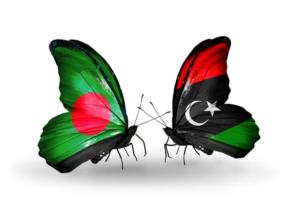 Vlinders met bangladesh en Libië vlaggen op vleugels — Stockfoto