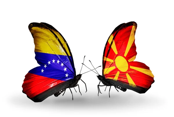 Motyle z Wenezueli i macedonia flagi na skrzydłach — Zdjęcie stockowe