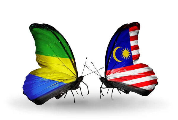 Butterflies with Gabon and Malaysia flags on wings — Stock Photo, Image