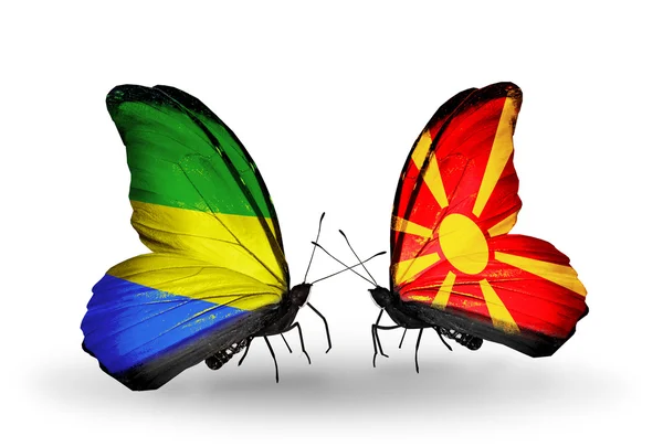 Borboletas com bandeiras Gabão e Macedônia em asas — Fotografia de Stock